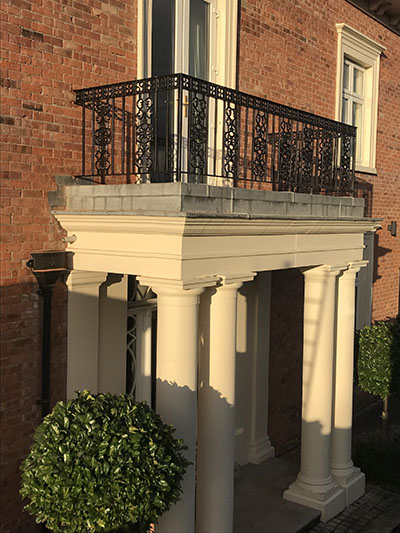 Black metal railings on balcony